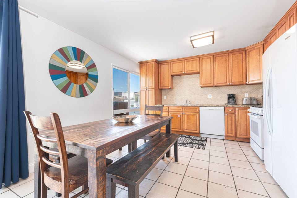 The kitchen opens out to the dining area, making meal prep a social affair
                