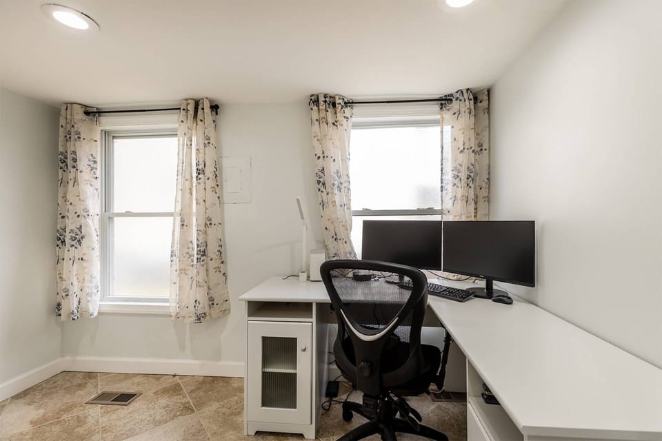 The private office space is located between the kitchen and the laundry room.