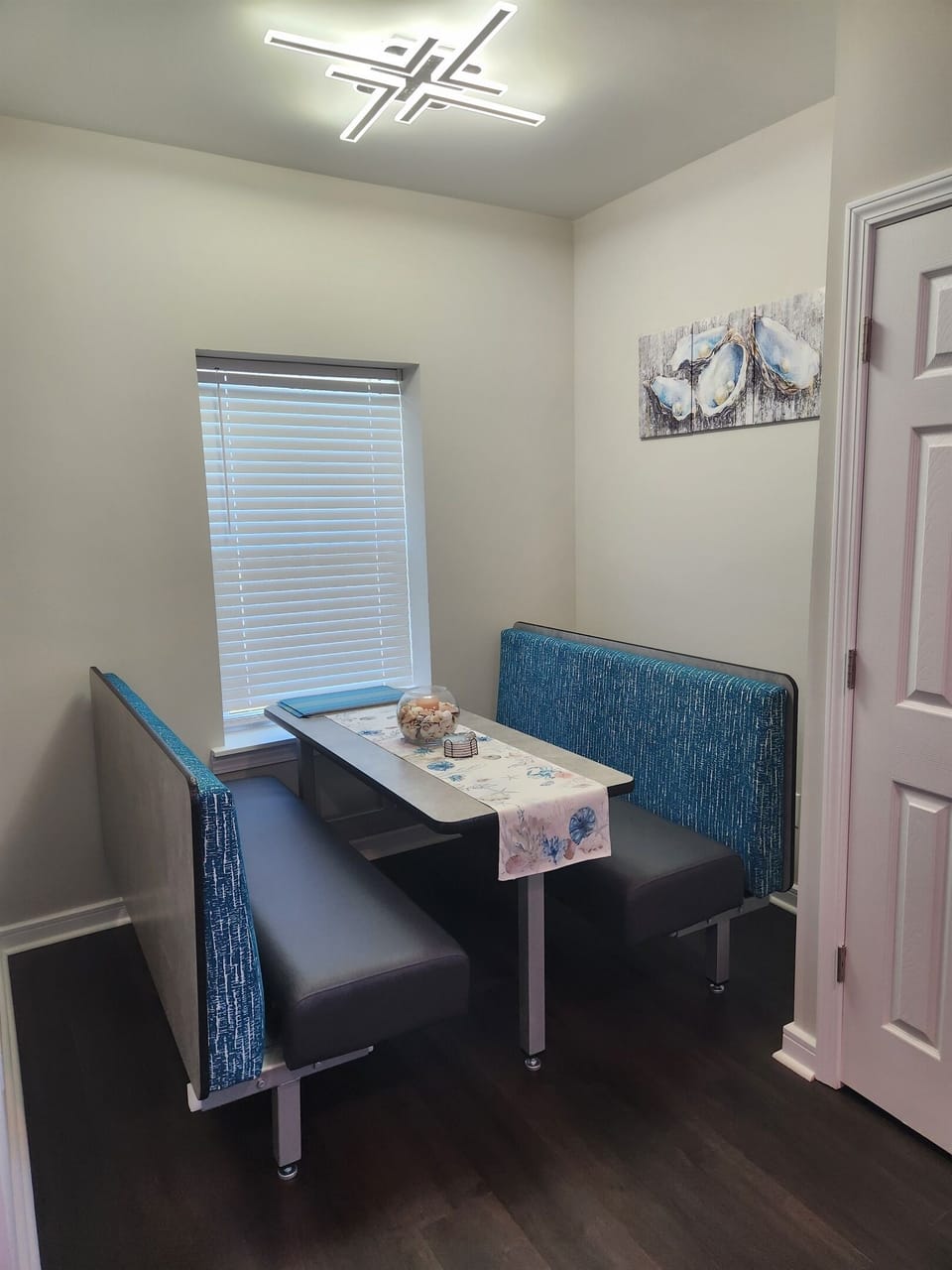 Tucked away just off the kitchen, this cozy dining booth is the perfect spot for morning coffee, casual meals, or evening board games