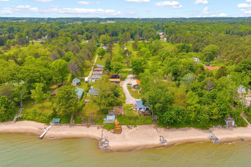 Tucked into a quiet stretch of shoreline, Cottage 2 sits in a five-pack of pure Michigan charm. Welcome to your lakefront basecamp.