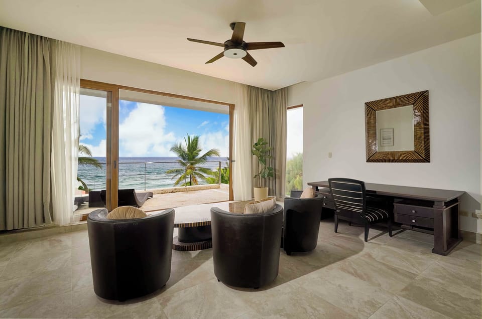 Oversized master suite with two queen beds in separate spaces within the same room, plus a large private bathroom.