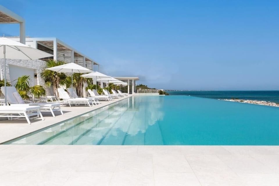 Glide into crystal-clear infinity edges with endless ocean views.