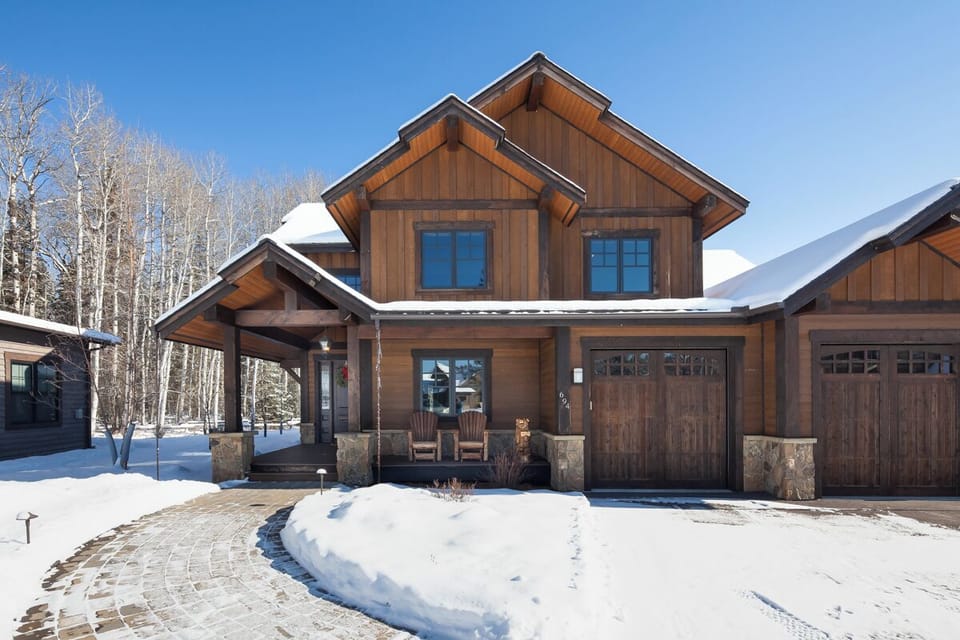 Arrive to a warm mountain home framed by fresh snow.
