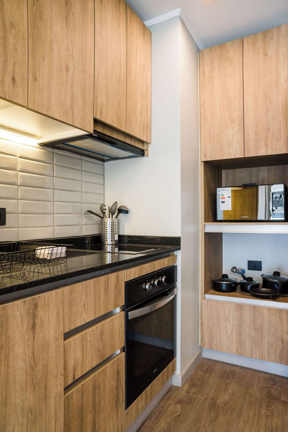 Modern kitchen with sleek appliances and ample storage, perfect for culinary adventures.