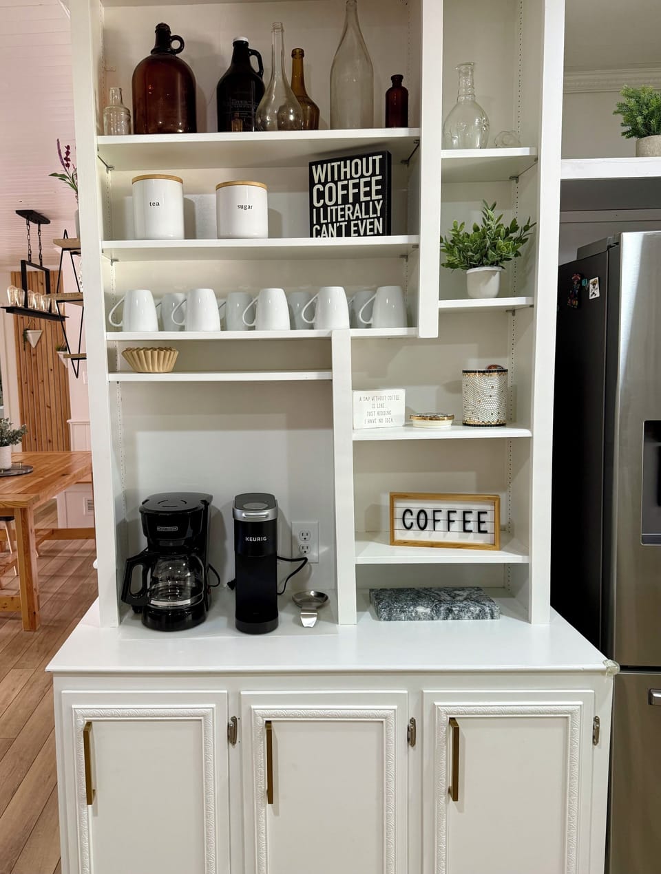 A handful of k-cups, coffee, kettle, sugar and various bags of tea available.