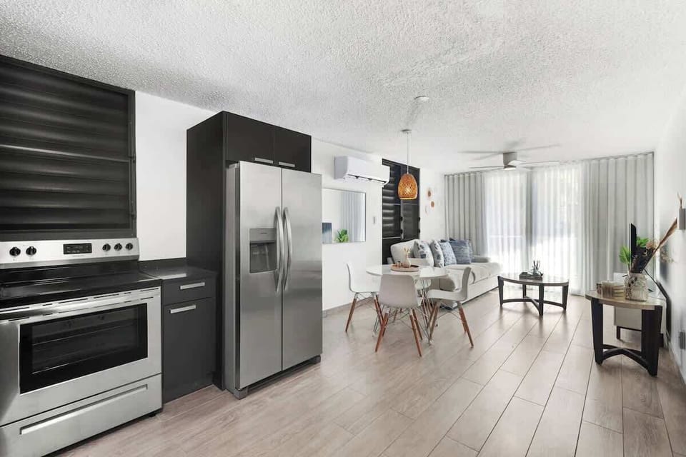 A bright kitchen with modern details and ample storage space.

