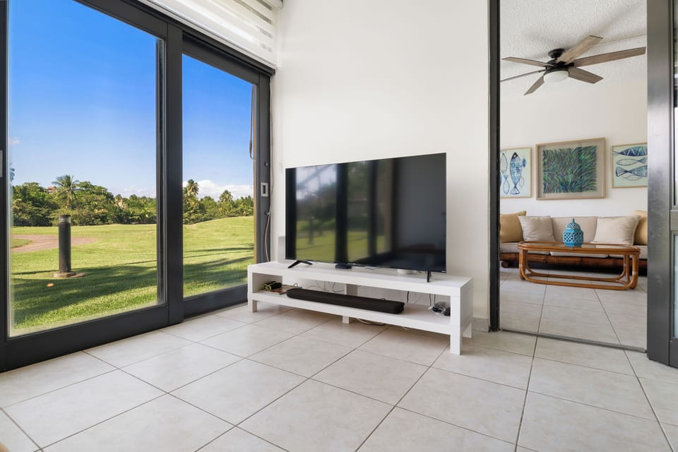 Enjoy your favorite shows on the large screen in this modern living room.

