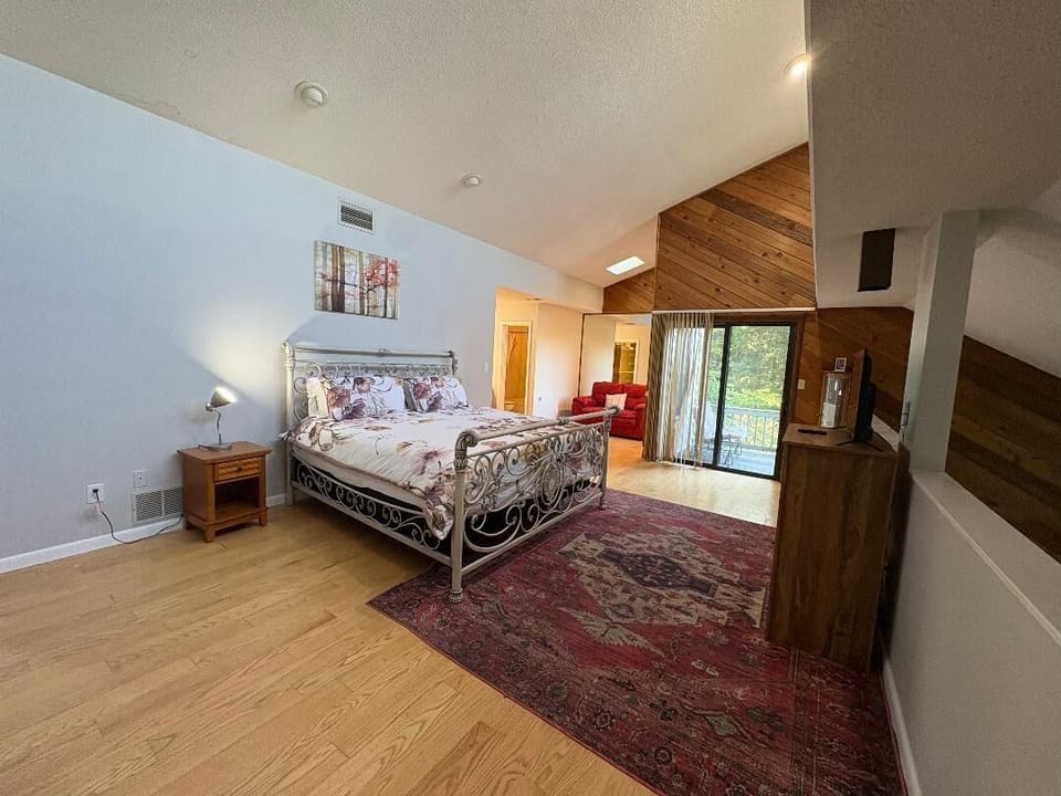 Master King bed, Door to Balcony with seating. Walk in closet, Master bath with 