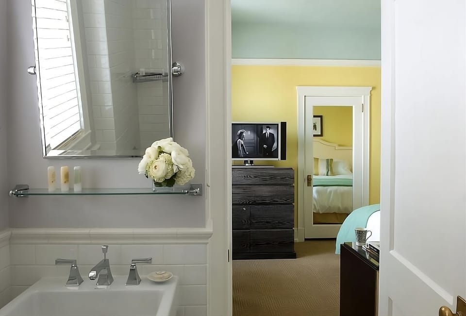 Get ready easily with a classic vanity and deep tub.