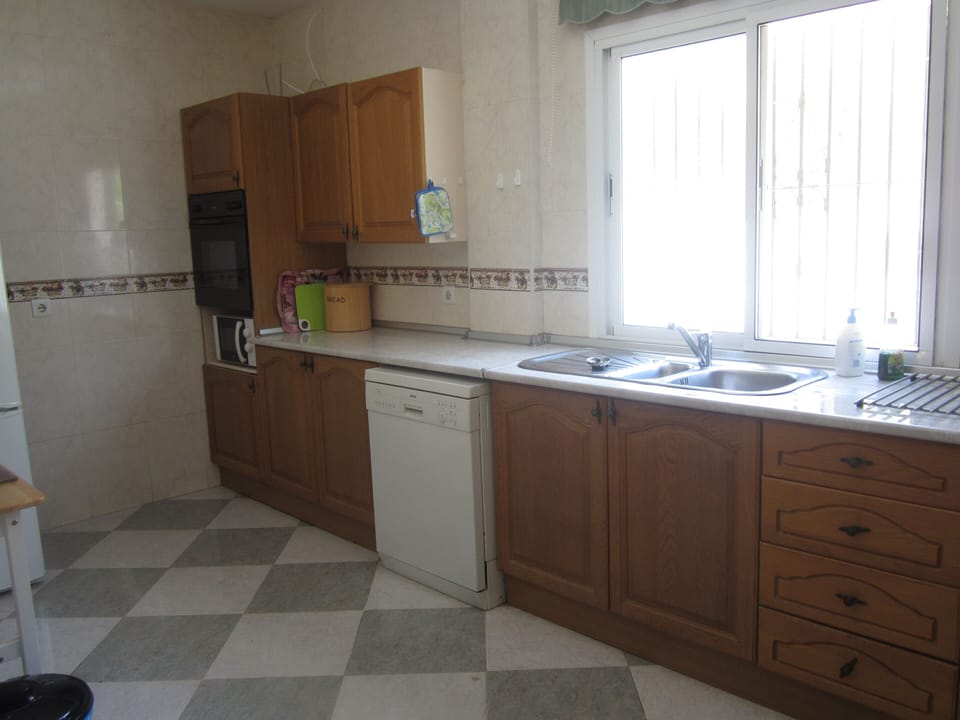 The kitchen; dish-washer; kitchen units; ovens; work-top.