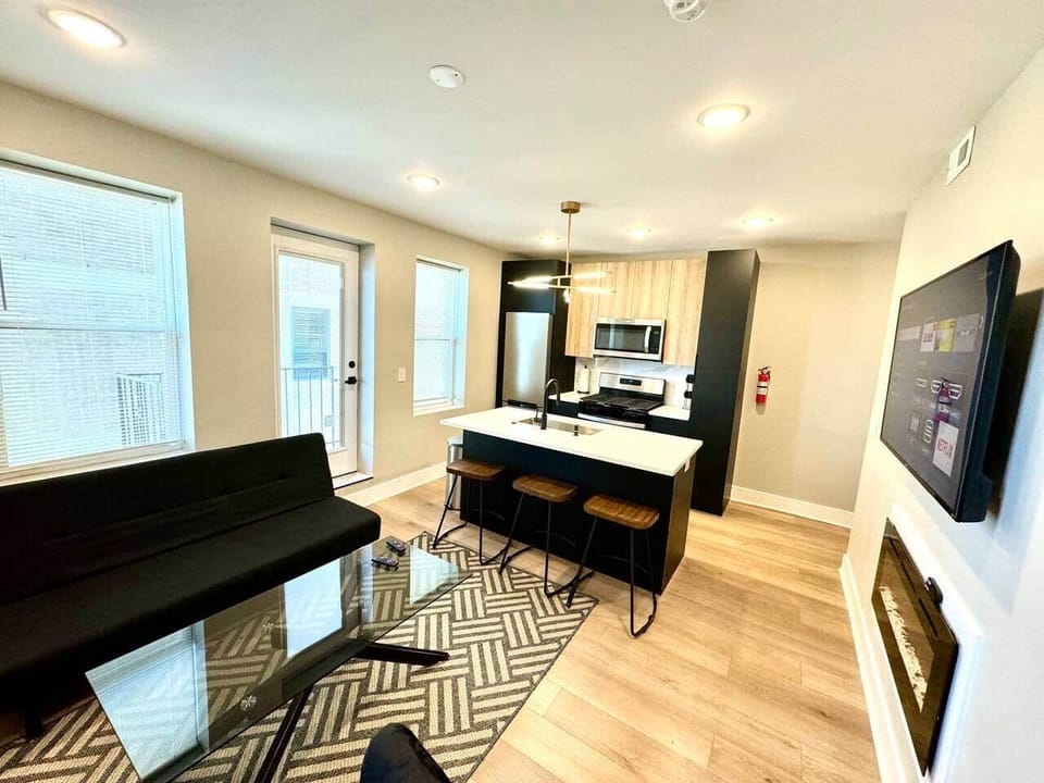 Brand new kitchen and appliances with breakfast bar, dishwasher ,microwave, refrigerator. 
Joined with the living room with  sofa bed, large flat screen tv , and a fireplace.