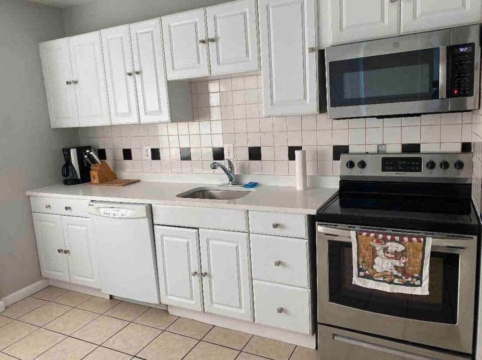 Full kitchen , refrigerator, microwave, dishwasher ,stove oven, dishes, pots and pans.