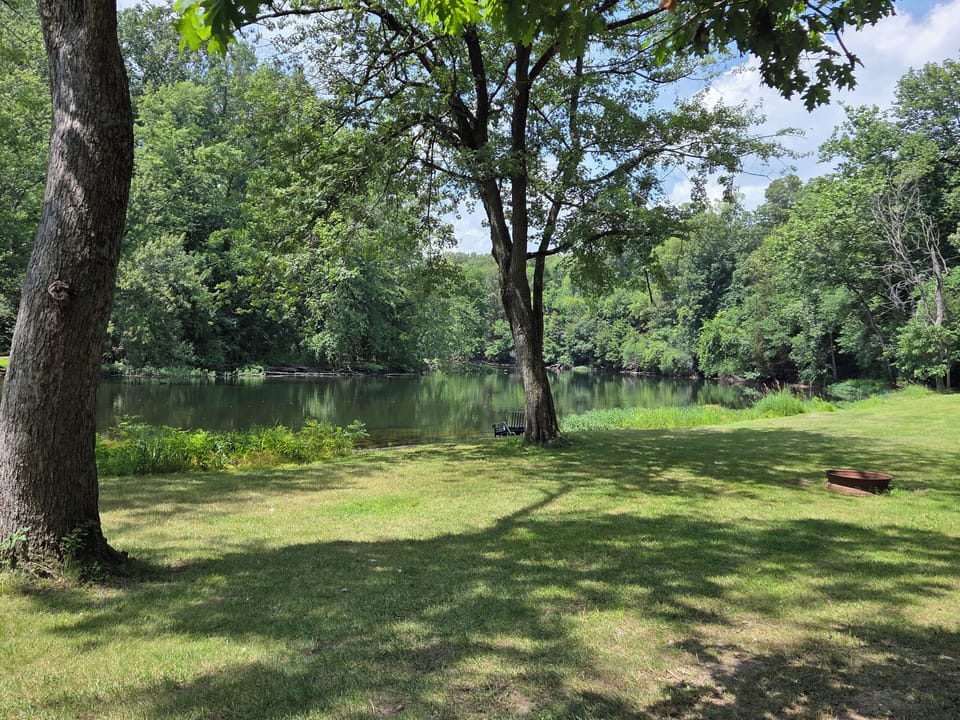 Firepit and beach alongside the St. Joseph river