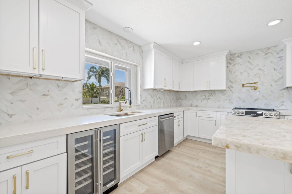 Kitchen is very light and offers plenty of countertop space for cooking.