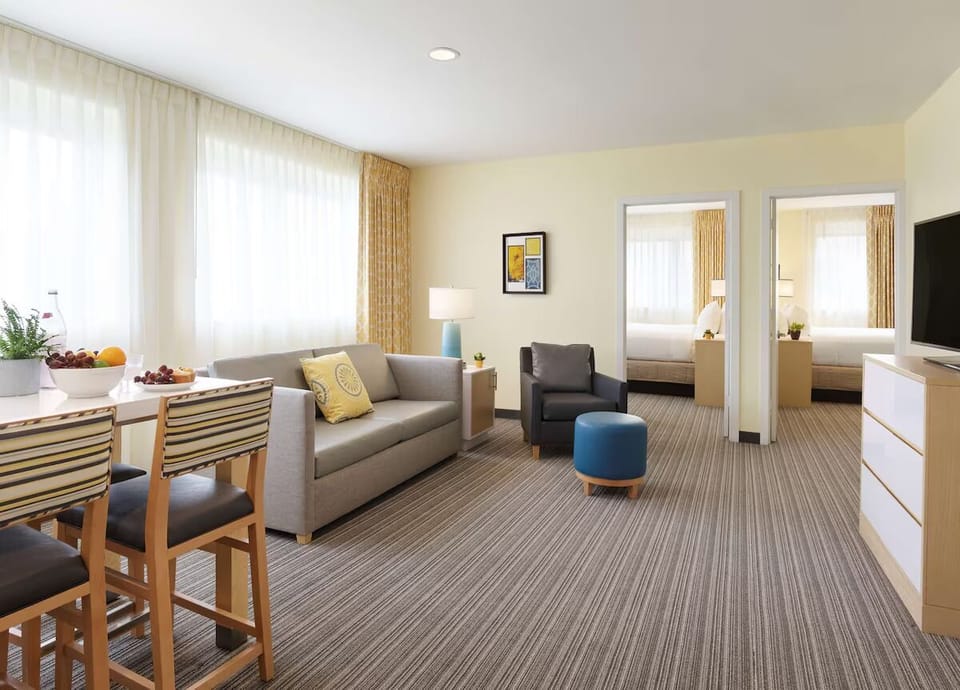 Settle into the open-plan suite—lounge, dine, and recharge.