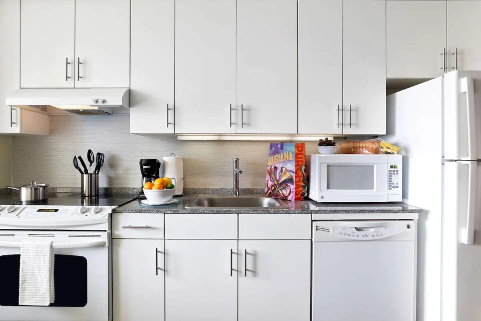 Start mornings easily with full appliances, coffee, and ample counters.