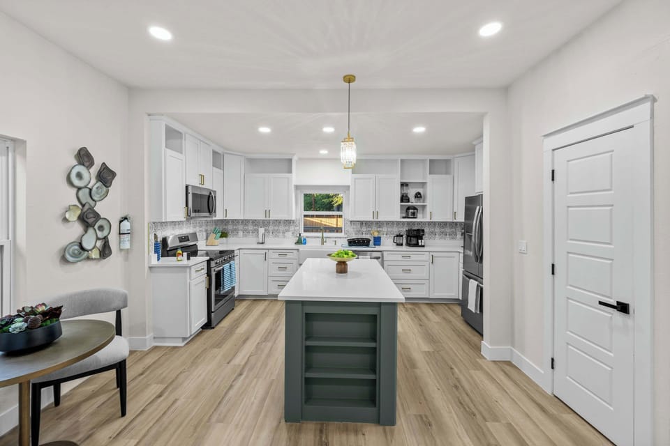 Enjoy a bright, modern kitchen with a spacious island that’s ideal for meal prep, coffee chats, or evening wine.