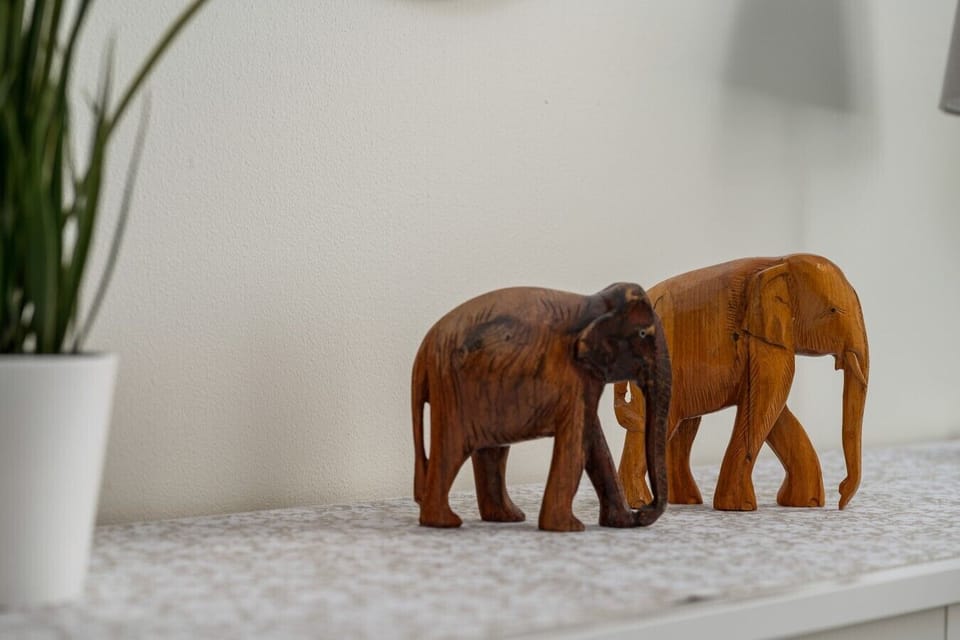 Carved wooden ornaments adding a warm touch to the bedroom.