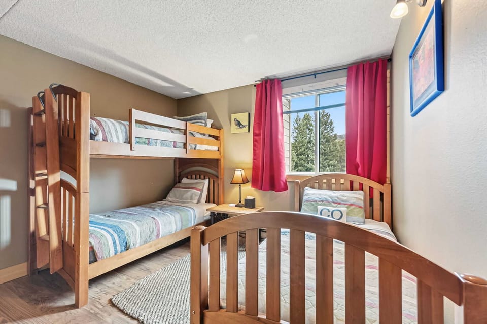 Bedroom 2: 1 twin bed, twin-over-twin bunk bed, dresser, closet