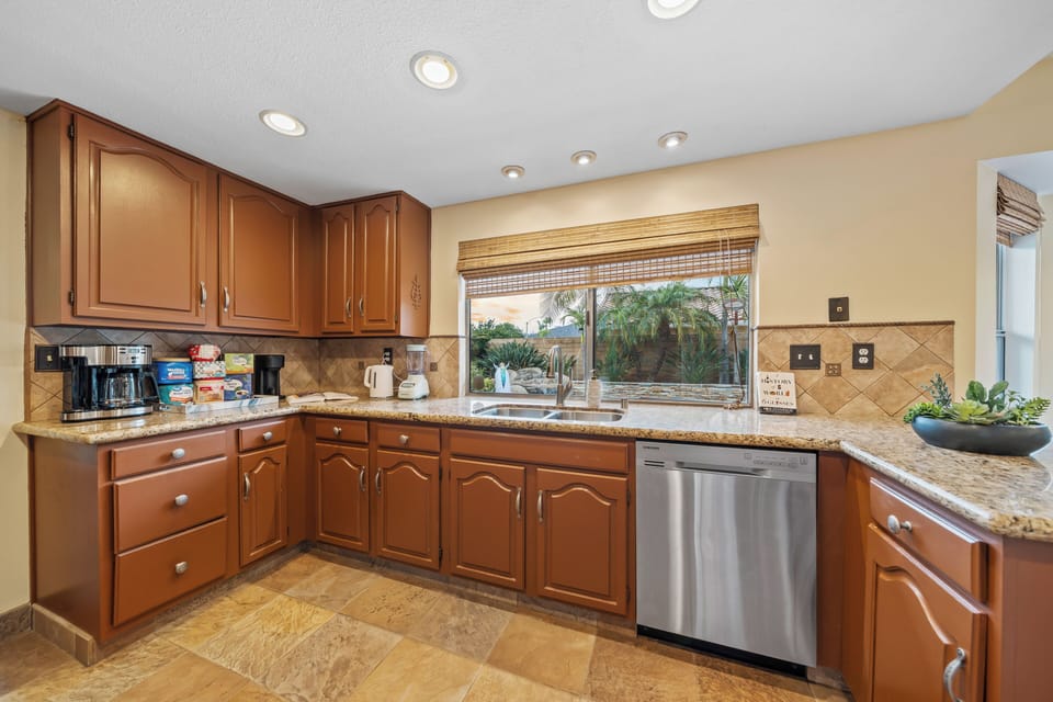 Easy cooking and cleaning with a large sink and dishwasher.