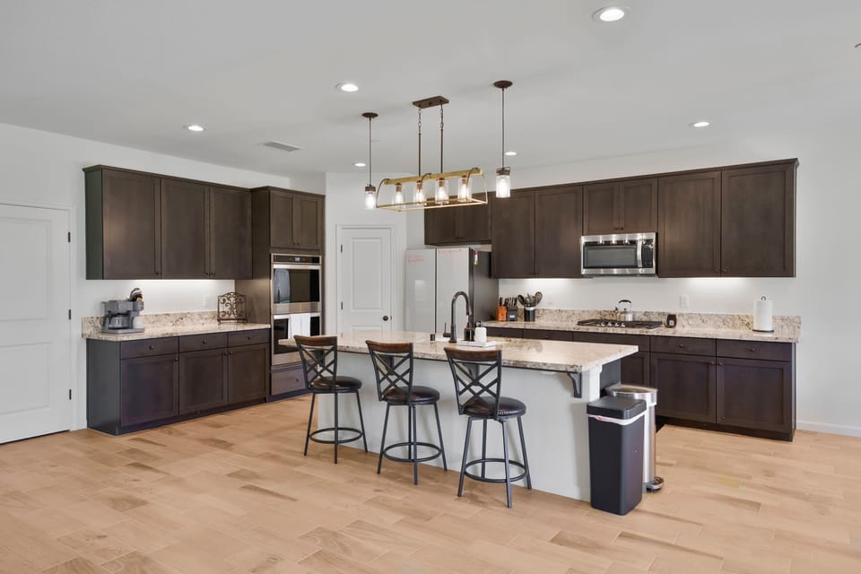 Fully stocked kitchen with stainless steel appliances