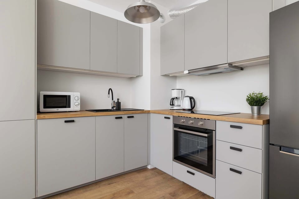 The fully equipped kitchenette includes everything you need for a home-cooked meal.