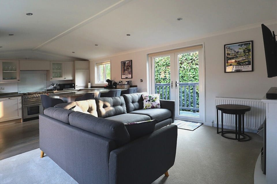Lounge and kitchen with American fridge freezer