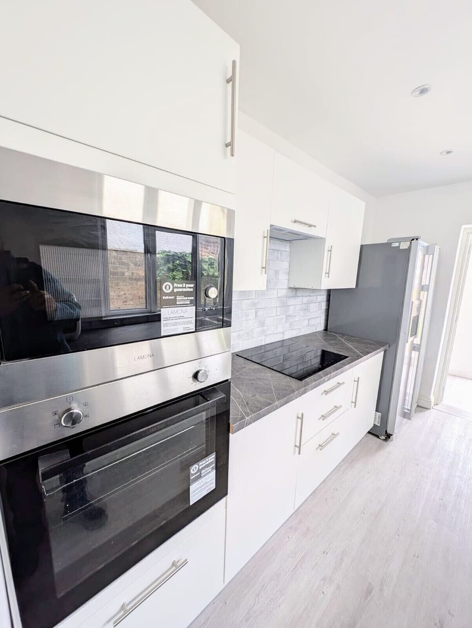 A sleek, fully-equipped modern kitchen with everything you need for home-cooked meals. Convenient combination microwave for quick and easy meals.