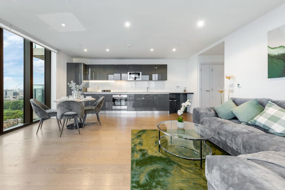 Open-plan living and dining area with modern decor, natural light, and a cozy ambiance for relaxing or entertaining.