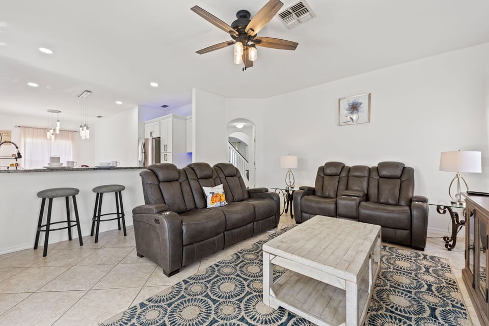 Open Layout – Living room view into kitchen and dining for easy family gatherings.