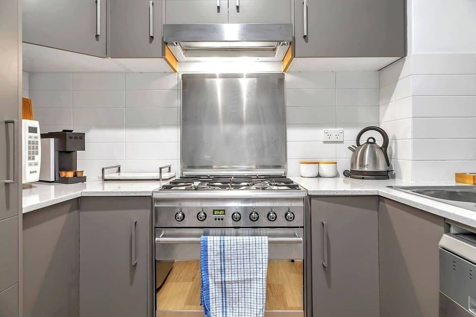 Whip up anything from easy breakfasts to family dinners in the compact kitchen, complete with a gas stove, oven, microwave, dishwasher, fridge and Nespresso machine.