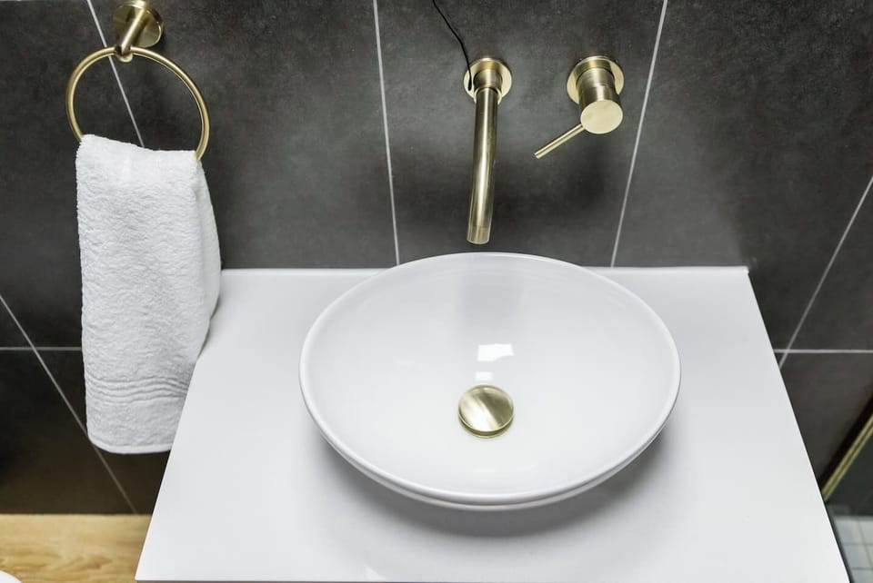 Enjoy modern fixtures in your en-suite bathroom, giving spa-like vibes. 
