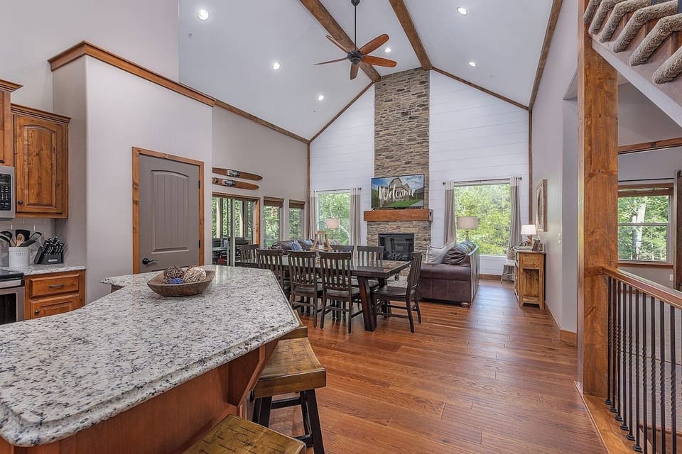 Big gathering area w/kitchen, big dining table, and great room 65" Smart TV