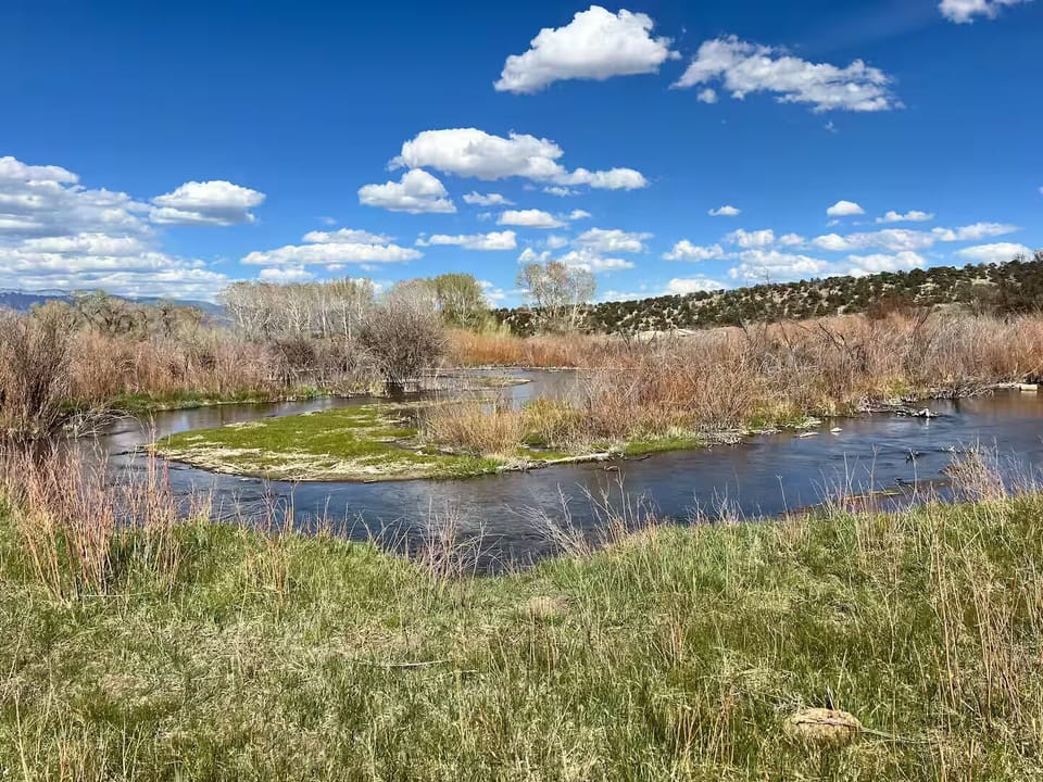 Huerfano River behind the house.