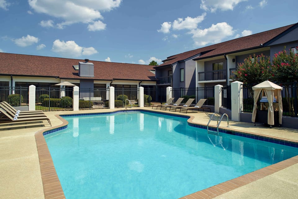 Dive into sunshine and unwind beside the sparkling pool.