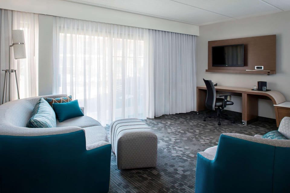 Relax together in the airy lounge area beside sunlit windows.