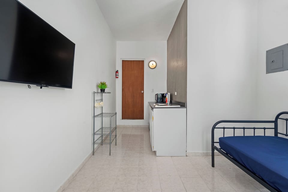 Indulge in your favorite shows on the sleek flat-screen TV.