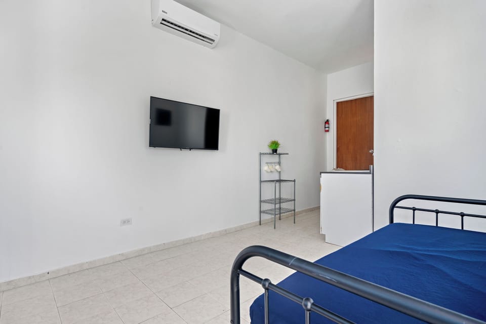 A compact modern room with up-to-date amenities for a convenient stay.