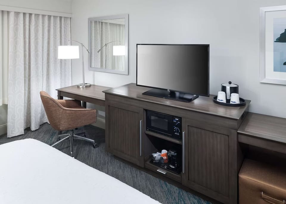 Enjoy convenient in-room entertainment and a practical workstation.