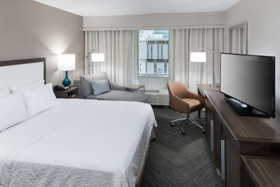Relax in a sunlit room with comfortable lounge seating.