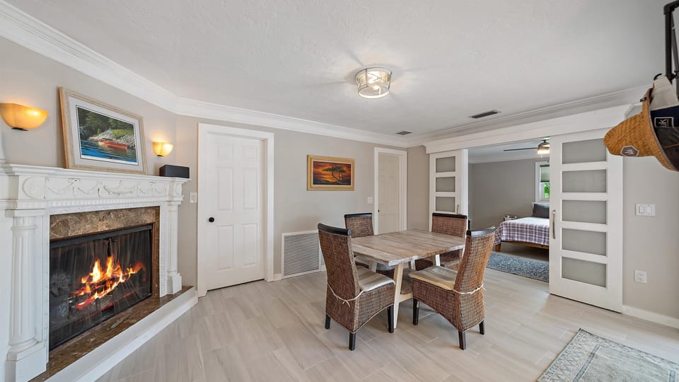 Cozy dining room with fire place for relaxing and family dinners.