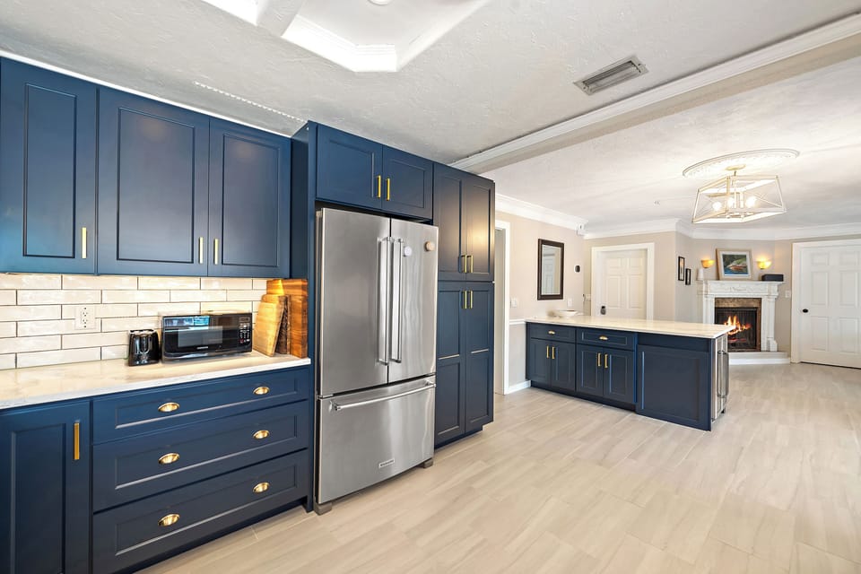 Stainless steel updated appliances in spacious updated kitchen overlooking the dining room.