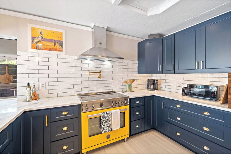 Gorgeous updated vibrant gourmet chef kitchen with plenty of cooking essentials.