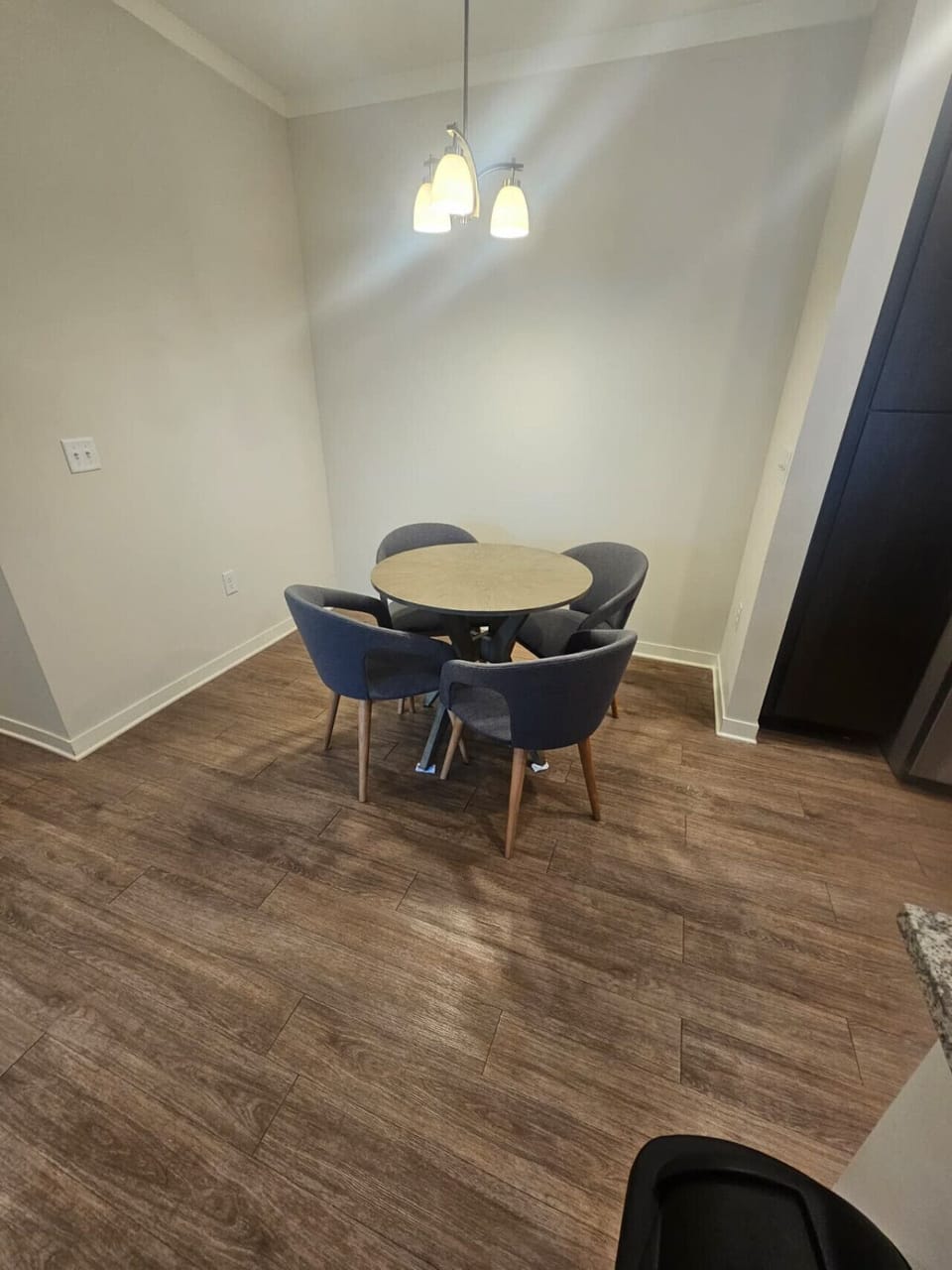 Inviting dining area featuring stylish chairs, warm lighting, and a relaxed ambiance for shared meals.