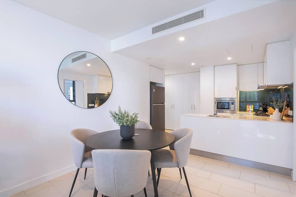 Whether dining or catching up, the round table with cushioned chairs for four creates a welcoming setting.