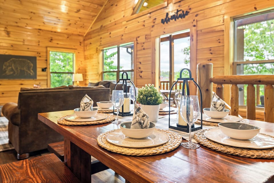 [Dining] A beautifully arranged dining table with warm cabin décor, rustic place settings, and lantern accents - perfect for cozy meals together.