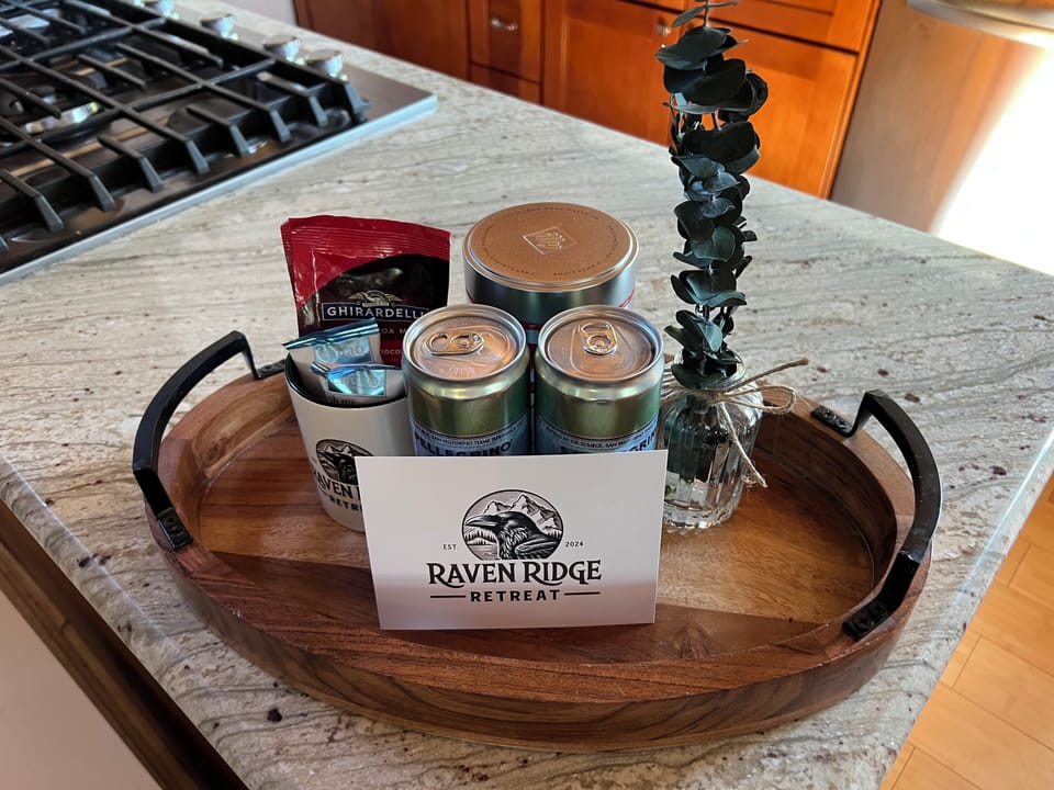 A little ‘hello’ from Raven Ridge Retreat — your guest gift includes local sips, sweet treats, and a custom mug to take home and remember your stay by.