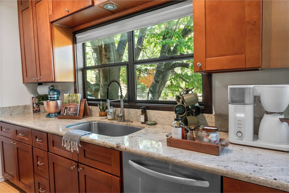Fix a cup at the coffee and tea bar—Café coffee maker, sweeteners, cream, and flavored syrup—then sip it on the upper deck, in the hanging chair, on the lower lounge, the under-deck swing, or at the bar while meals are made.