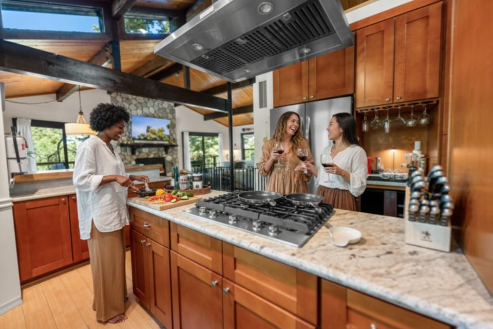 Prepare meals with HexClad pans while staying connected—the open kitchen flows seamlessly into the dining and living spaces.