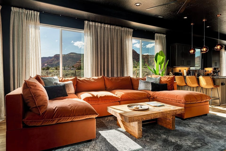 Spacious open-concept living and dining with views of the red cliffs